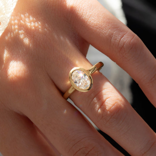 1.50 Carat Lab Grown Oval Diamond Bezel Engagement Ring in 14K Yellow Gold