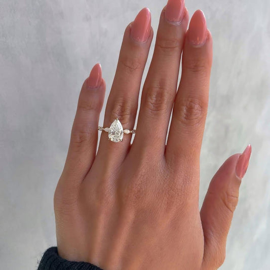 0.50 CT Pear Solitaire Ring With Marquise Pave Band A in 14K Gold