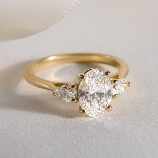 1.70 Carat Lab Grown Oval Diamond Nimi Trilogy Engagement Ring in 14K Yellow Gold